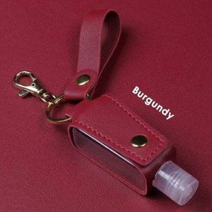 Keychain with hand sanitizer empty plastic bottle